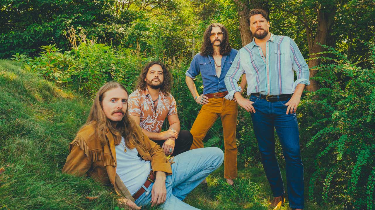The Sheepdogs posing in foliage