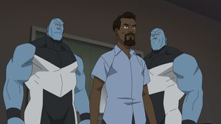 Angstrom Levy stands in a room as he's flanked by the Mauler twins in Invincible season 2