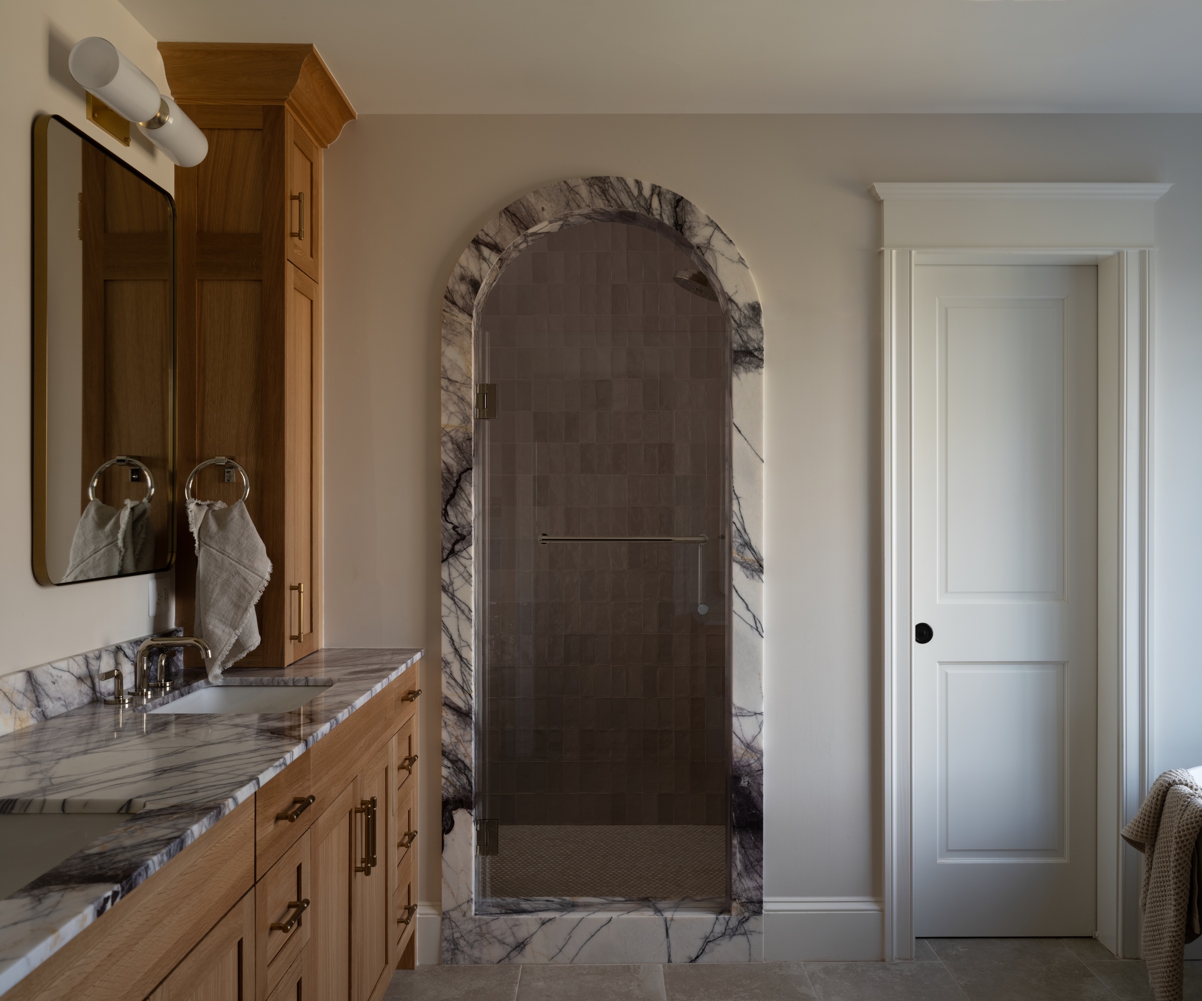 Bathroom with marble vanity unit and marble mirror