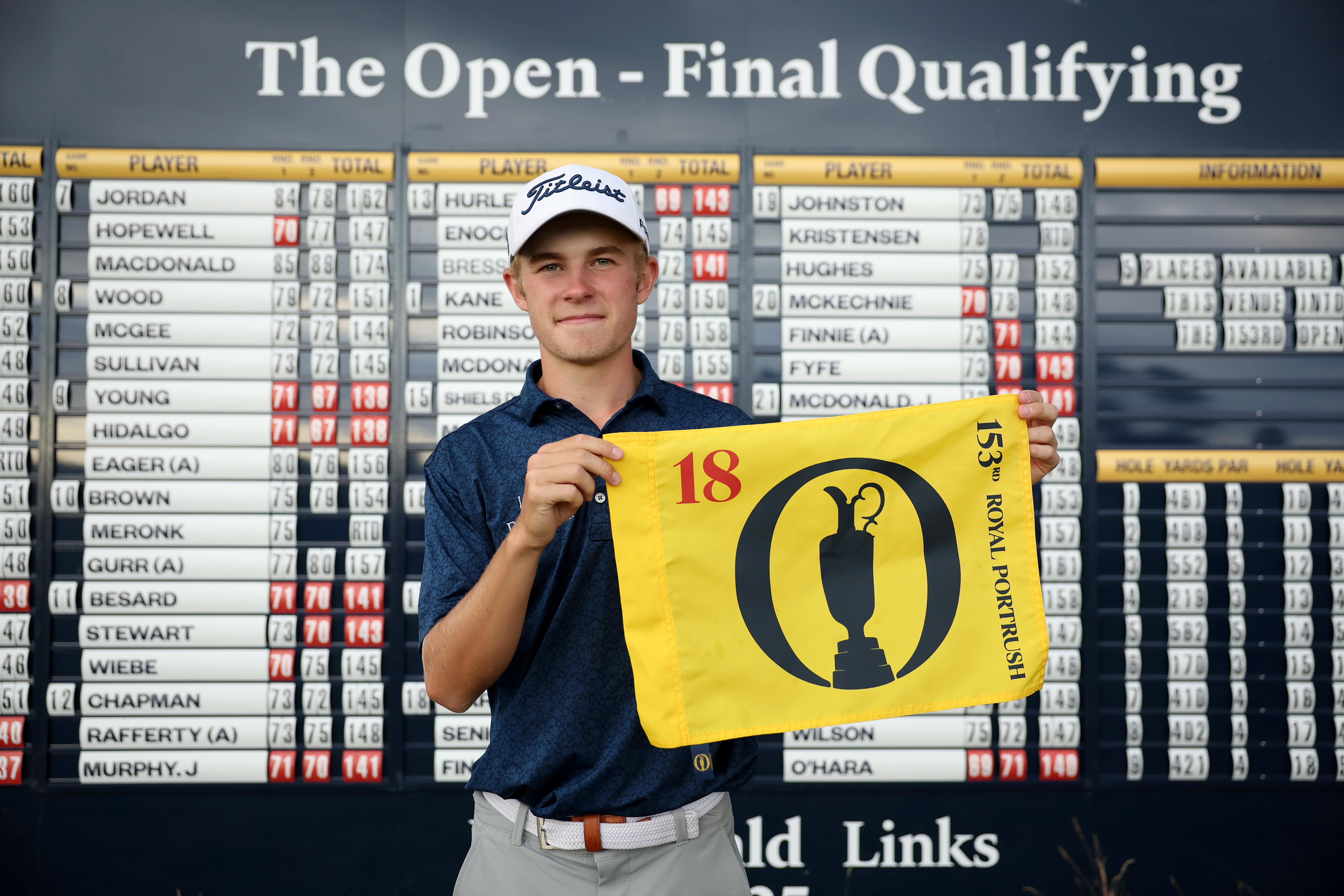 Connor Graham holds an Open Championship flag up
