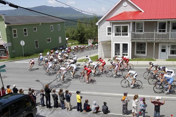The riders make their way into the final stretch of stage three, climbing Mont Megantic, which can be seen in the background.
