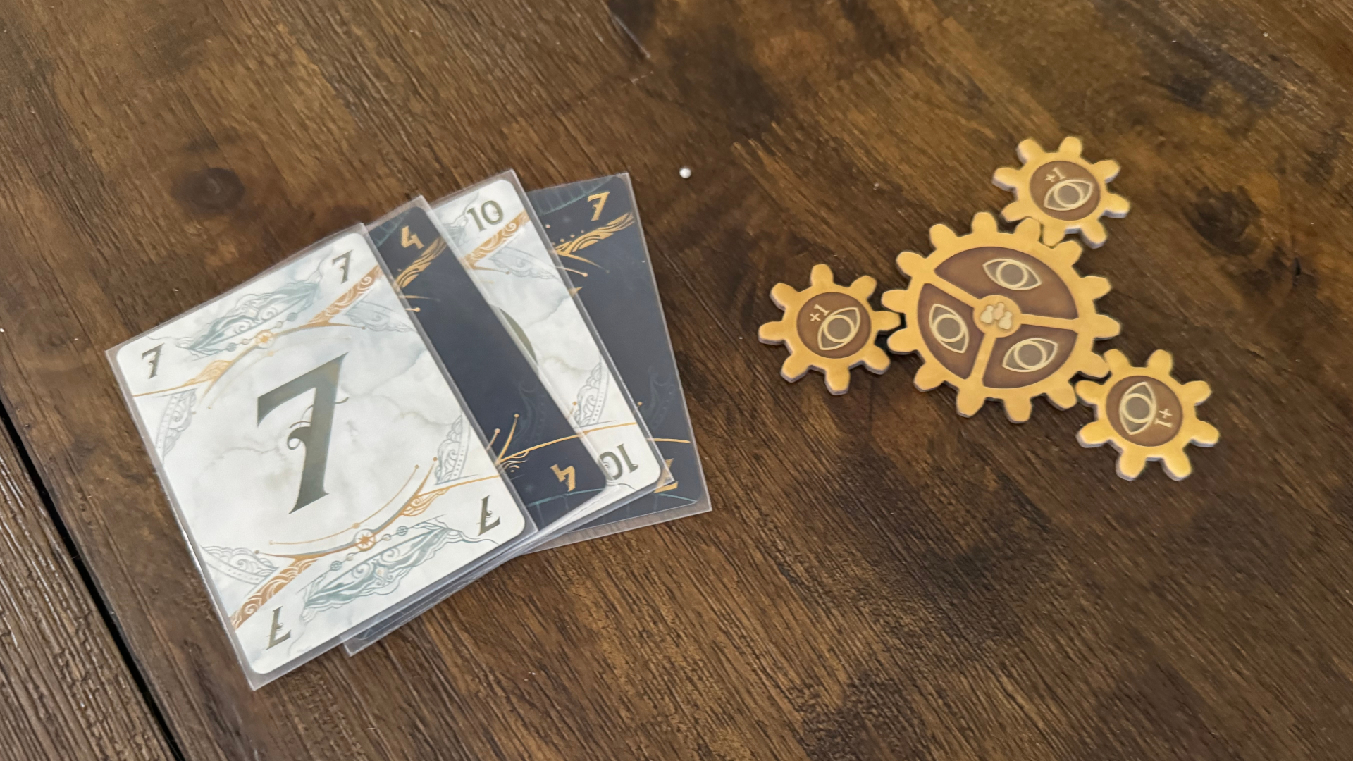 Take Time cards and tokens on a wooden table