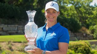 Suzann Pettersen with the Solheim Cup trophy