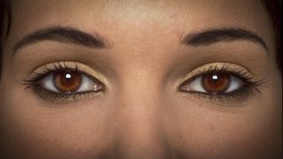 Close up of a pair of golden-brown eyes