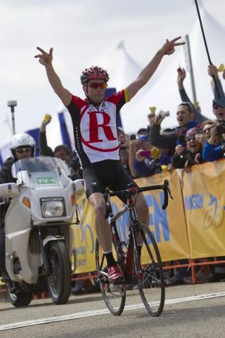 Chris Horner (RadioShack) salutes as he crosses the finish line at the top of Sierra Road