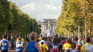 Runners in the Royal Parks Half Marathon on the Mall approaching Buckingham Palace