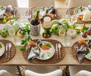 Pumpkin plates around a Thanksgiving table.