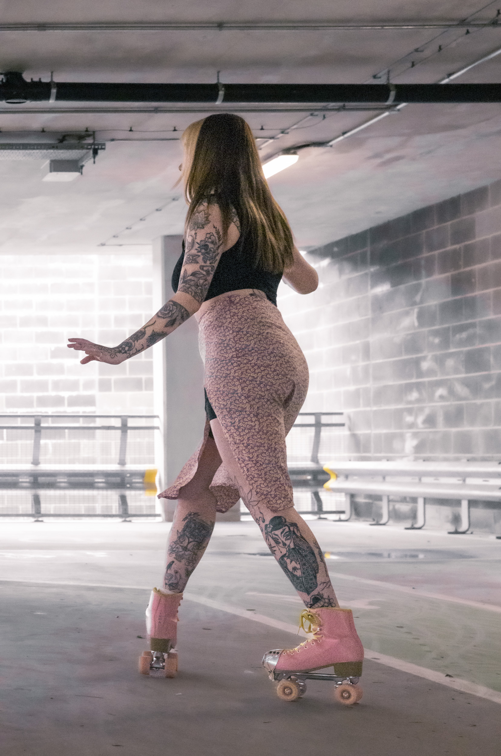 Canon EOS R8 sample image of a rollerskater in action dark lighting
