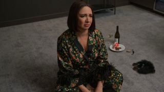 Maya Rudolph sitting on the floor of her mansion looking glum in Loot.