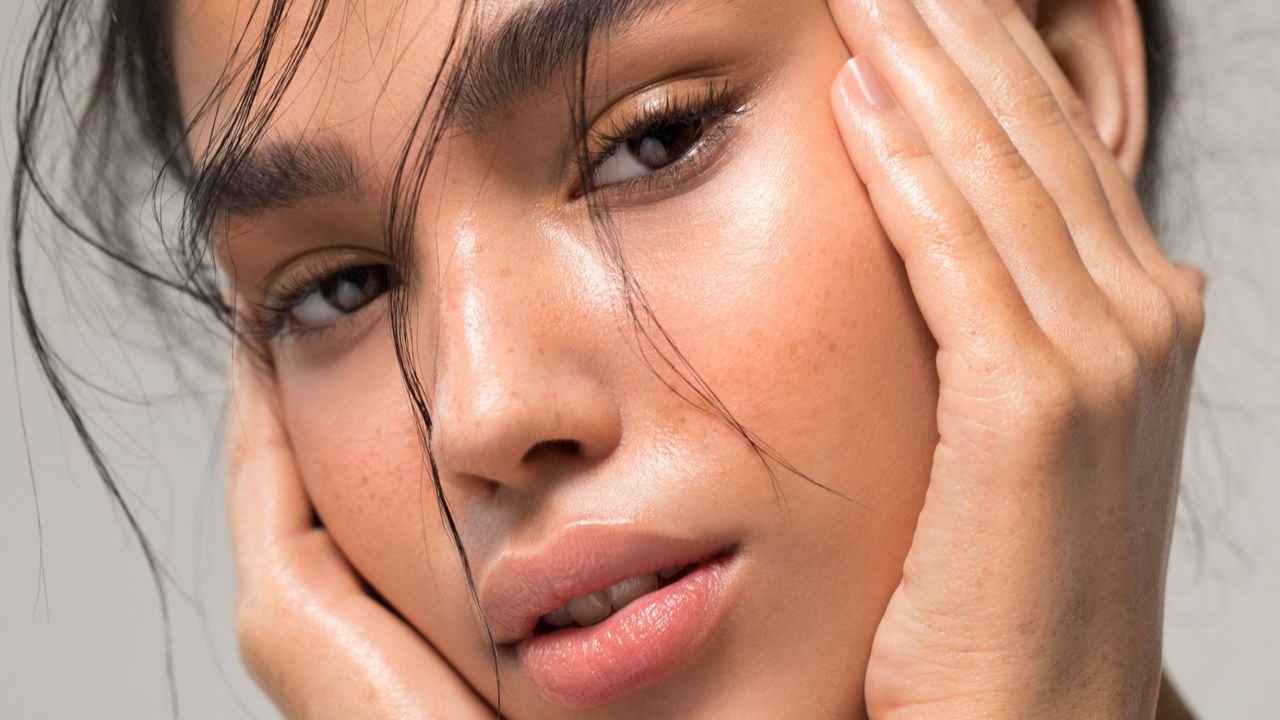 a close-up of a model - caffeine eye cream