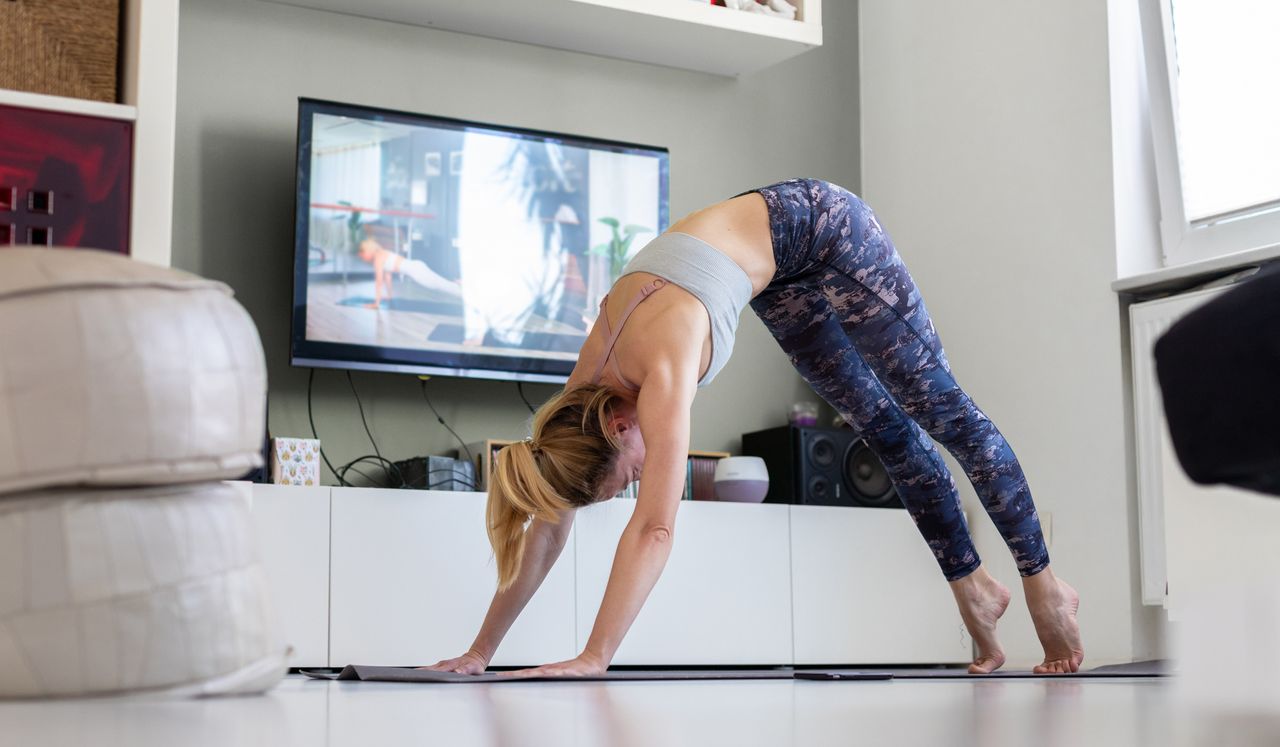 Woman doing yoga online