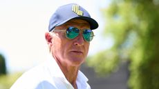 Greg Norman wearing a LIV Golf cap and sunglasses