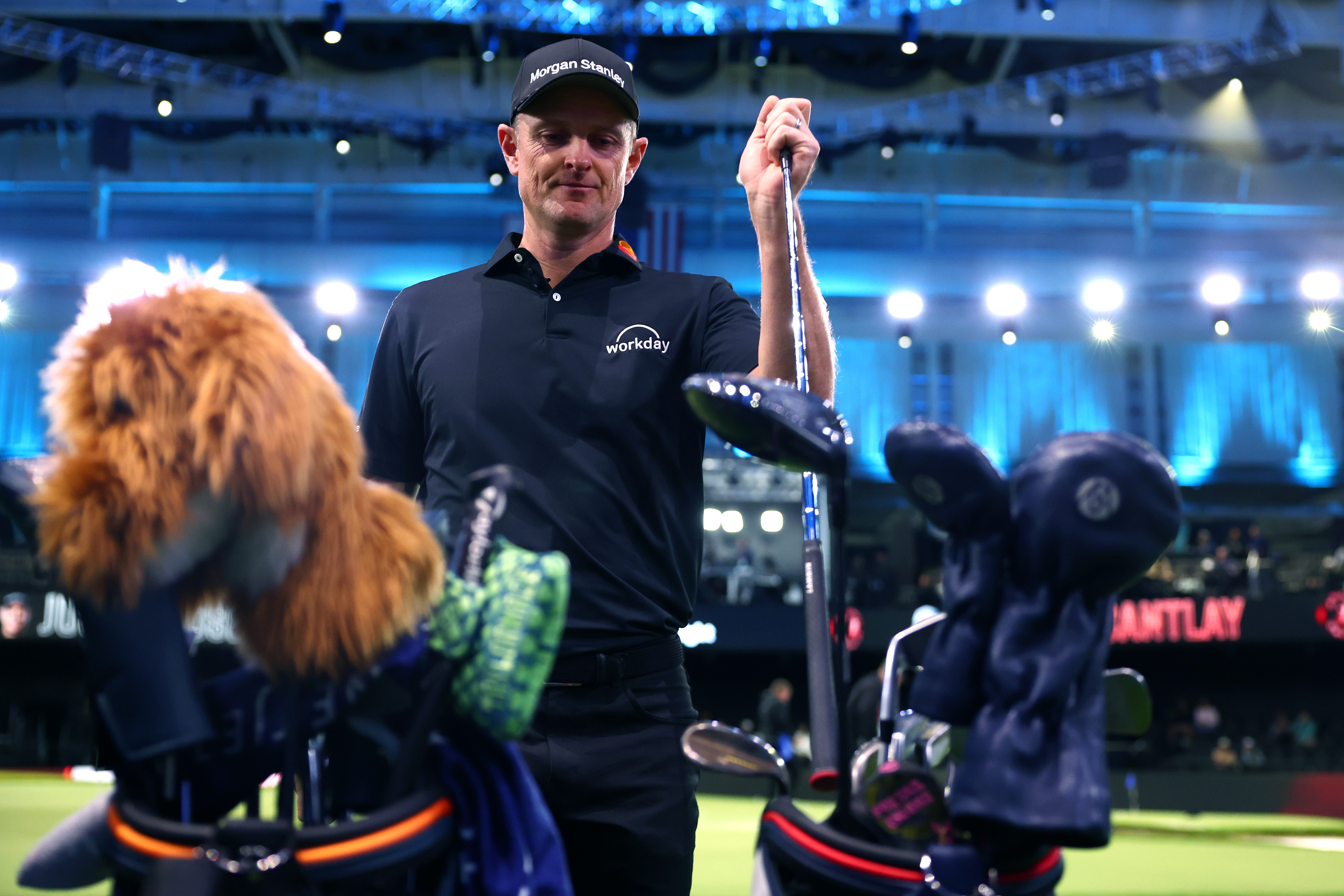 Justin Rose selects a club from his bag before the match against the Atlanta Drive GC at SoFi Center