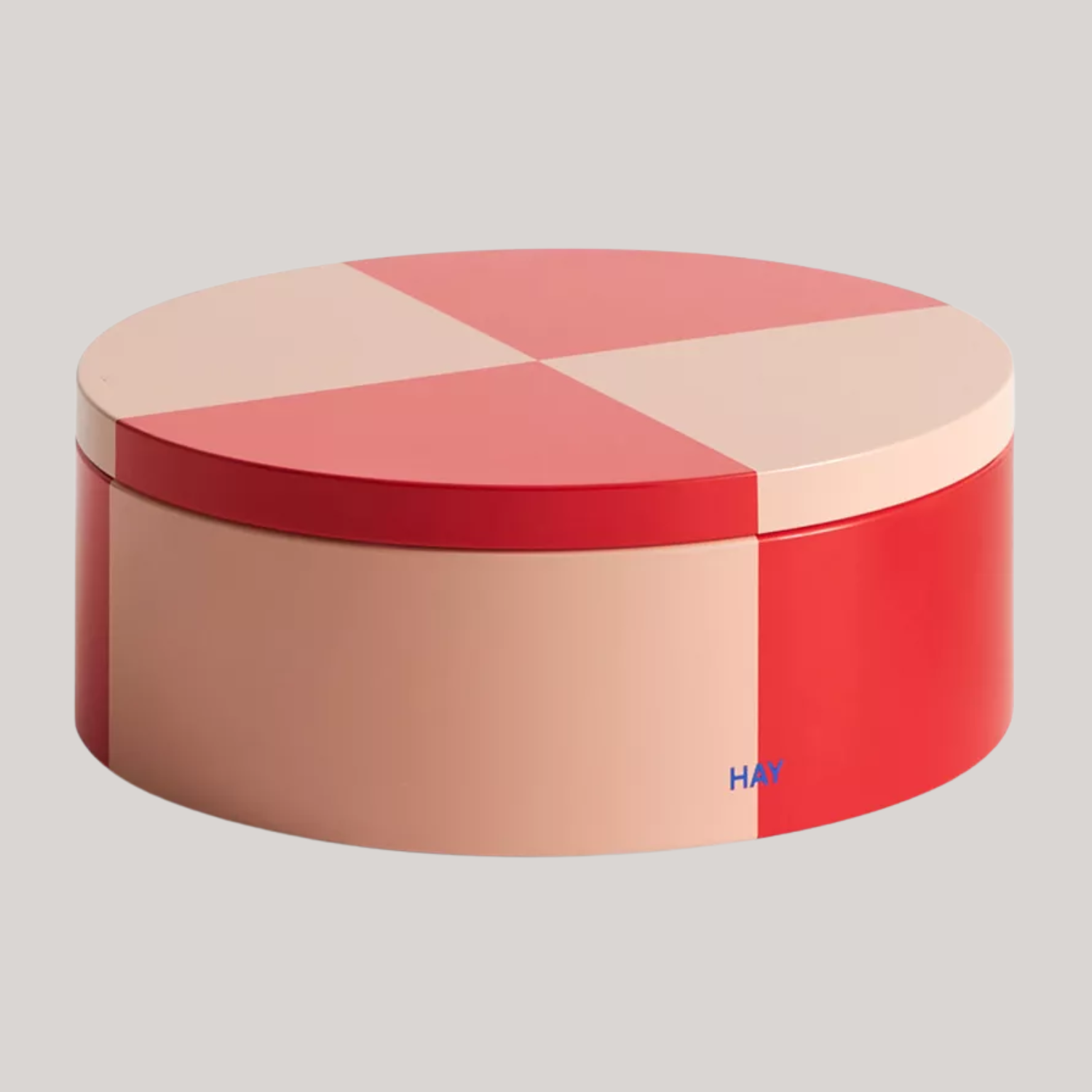 An orange and soft rose food storage tin