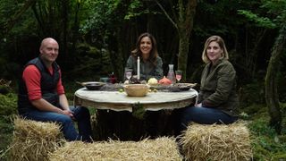 Julia dining outdoors in a tranquil forest setting with Bronagh and Cathal as part of the Burren Farm Experience.