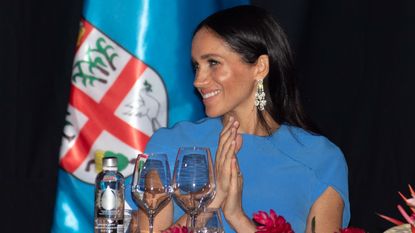 Meghan, Duchess of Sussex attends a state dinner hosted by the president of the South Pacific nation Jioji Konrote at the Grand Pacific Hotel on October 23, 2018 in Suva, Fiji. The Duke and Duchess of Sussex are on their official 16-day Autumn tour visiting cities in Australia, Fiji, Tonga and New Zealand. 
