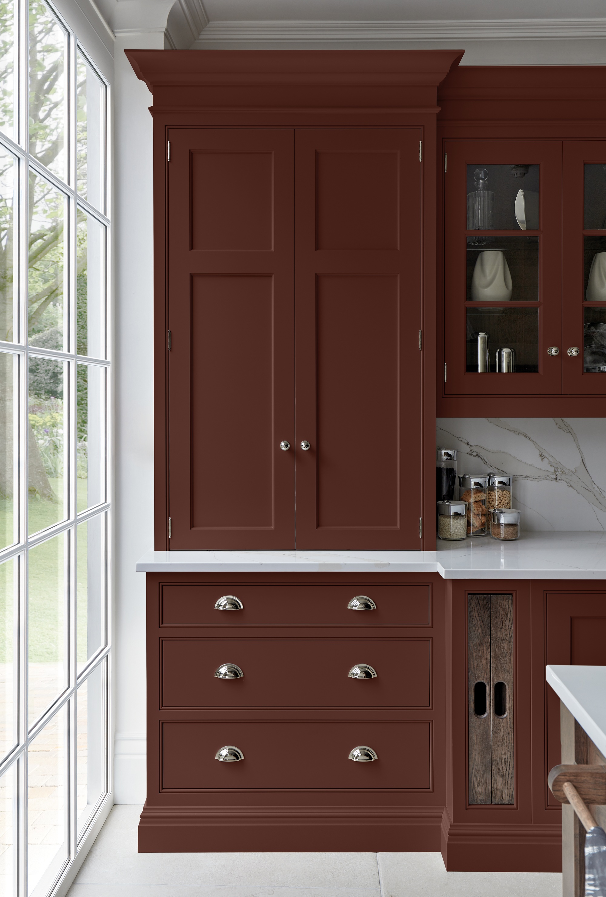 a brown-red shaker cabinet kitchen with storage