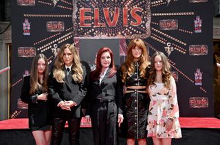 Harper Vivienne Ann Lockwood, Lisa Marie Presley, Priscilla Presley, Riley Keough, and Finley Aaron Love Lockwood attend the Handprint Ceremony honoring Three Generations of Presley's at TCL Chinese Theatre