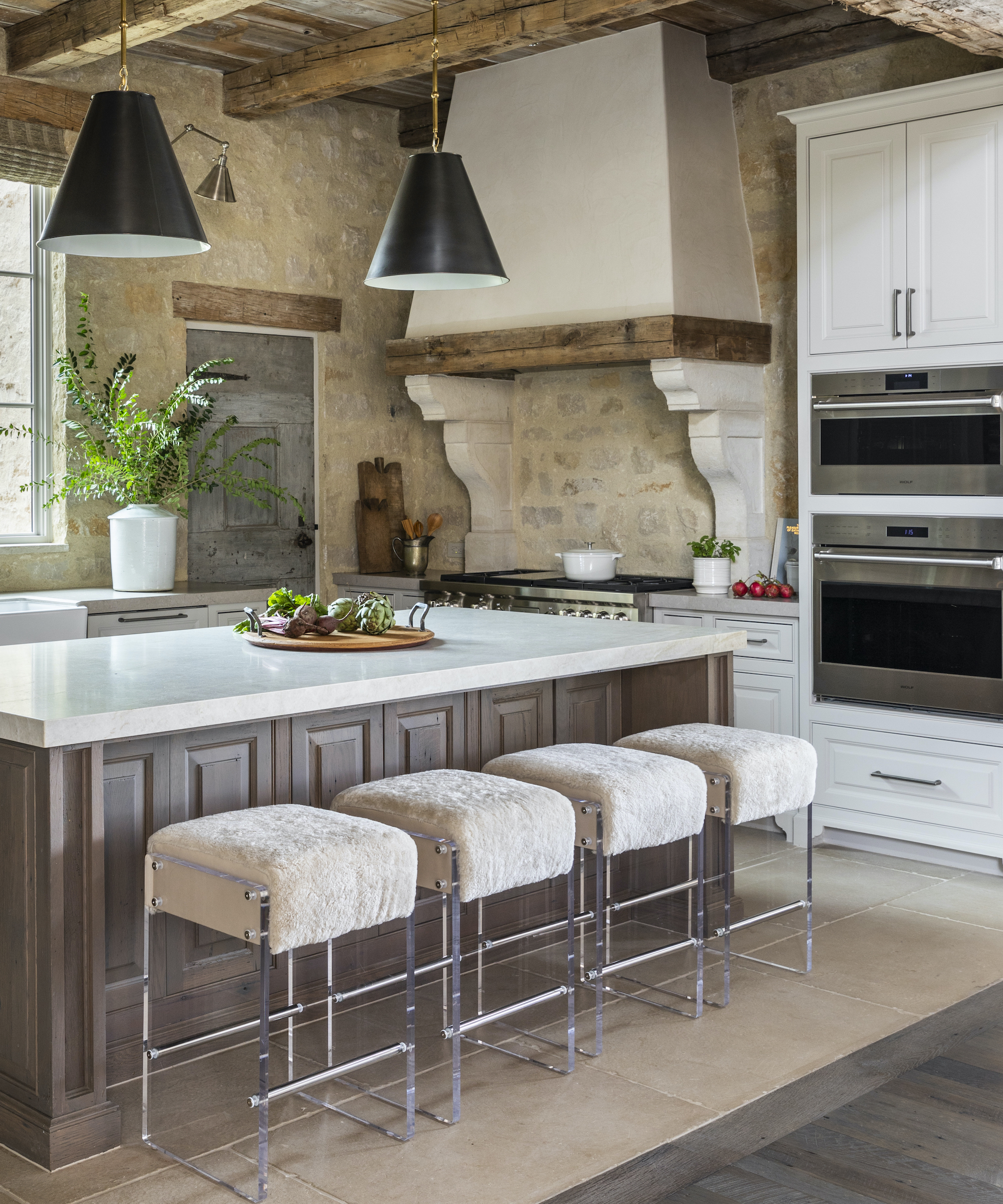kitchen cabinets in timber and white with four stools