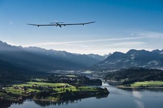 The solar-powered solar impulse plane flying over Switzerland