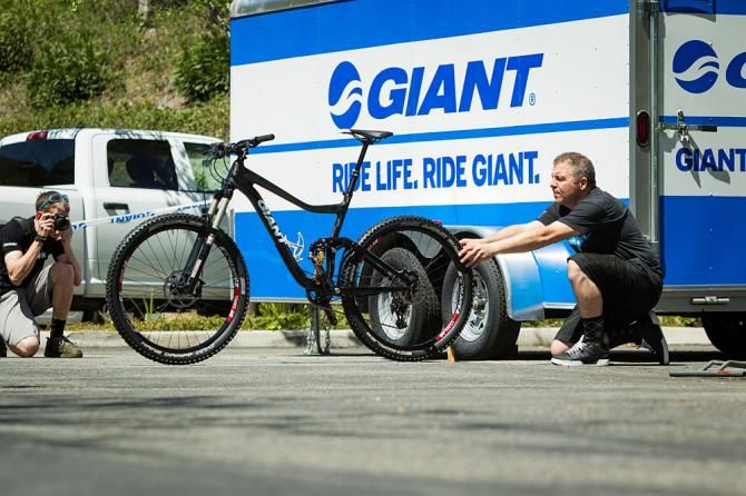 Photographers shoot the riders' bikes