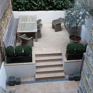 terrace garden with wooden table and chairs