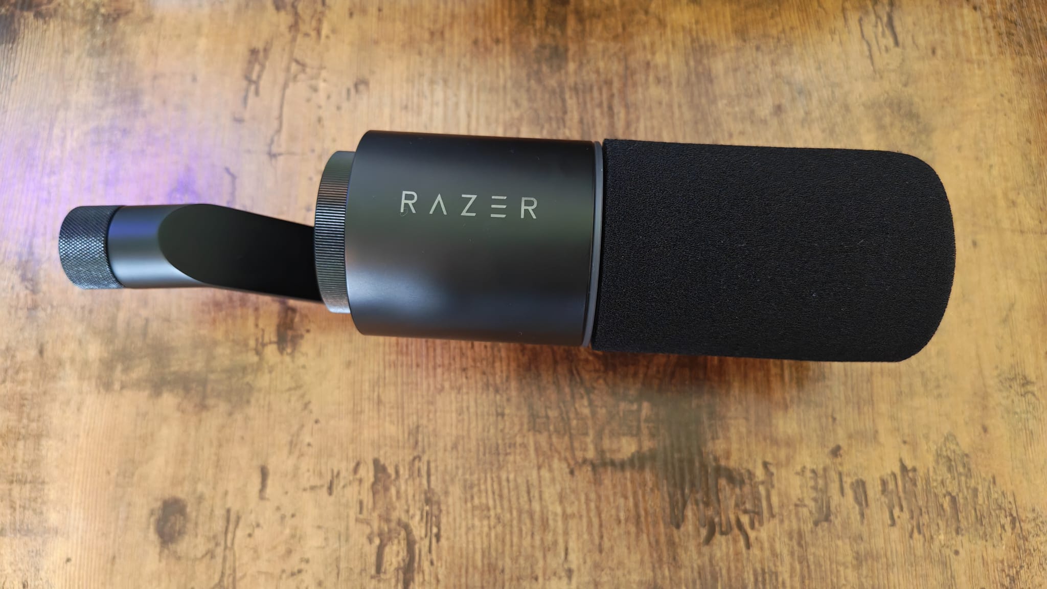 A Razer Seiren V3 Pro lying on a desk