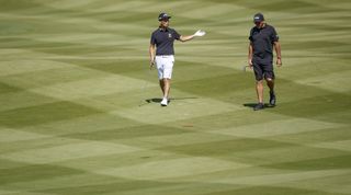 Na and Mickelson walk down the fairway