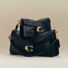 two black coach tabby bags on top of each other