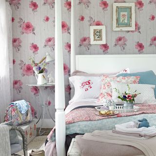 bedroom with bed and rose wallpaper