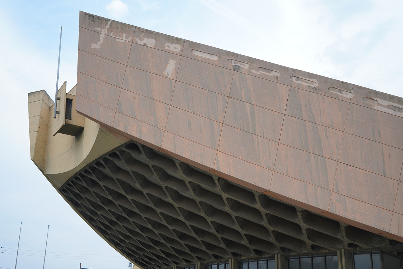 Kagawa Prefectural Gymnasium, Kenzo Tange's 'ship gymnasium' in Japan, a curved concrete structure currently under threat of demolition due to neglect