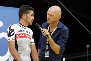Carlos Sastre is interviewed on the stage.