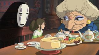 A girl sits down with spirits for dinner in Spirited Away