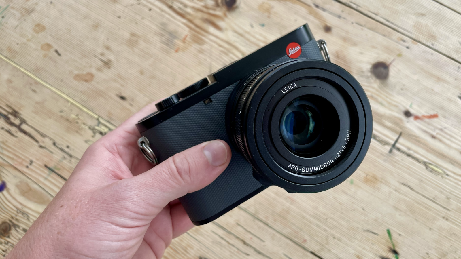 Leica Q3 43 camera on a wooden table