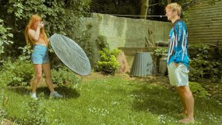 Hannah Rooke using a reflector for portrait photography