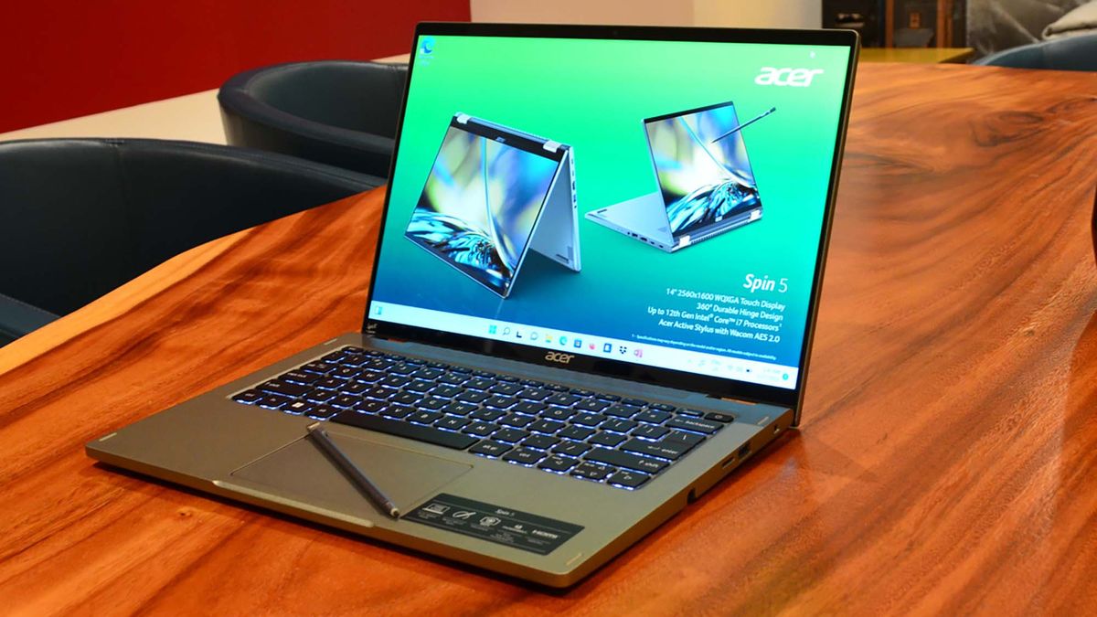 An Acer Spin 5 (2022) on a wood grain table