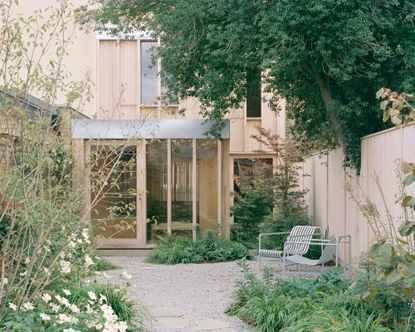 the minimalist architecture of spruce house seen from its garden view