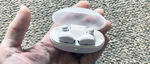 the oppo enco wireless earbuds in their charging case