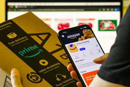Amazon shopping app displayed on smartphone with Prime delivery box
