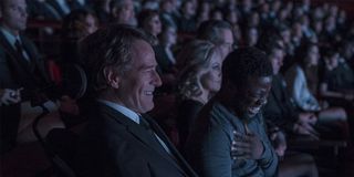 Bryan Cranston and Kevin Hart in The Upside laughing in a theater.