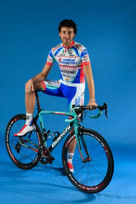 Riccardo Chiarini (Androni Giocattoli) throws a leg over his machine