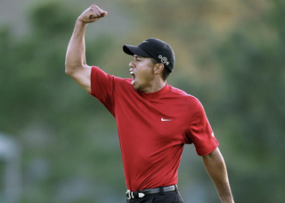 Tiger Woods fist pumps after winning the 2005 Masters