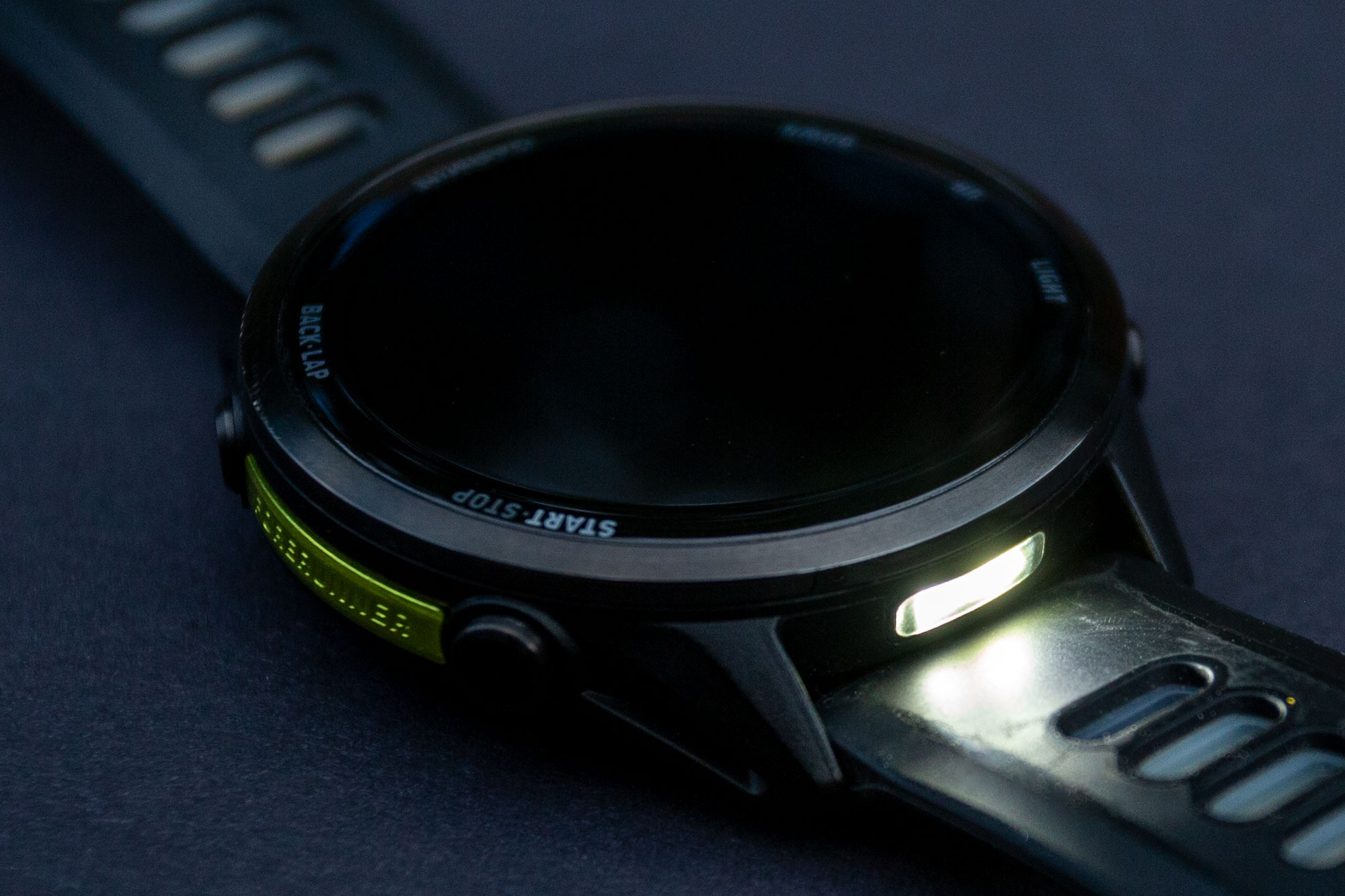 Garmin Forerunner 970's flashlight, situated between the top case lugs.
