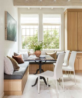 Wooden kitchen with white marble countertops and rustic fixtures