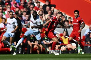 Liverpool midfielder fights for the ball with Aston Villa Moussa Diaby during the teams' Premier League game at Anfield in September 2023.