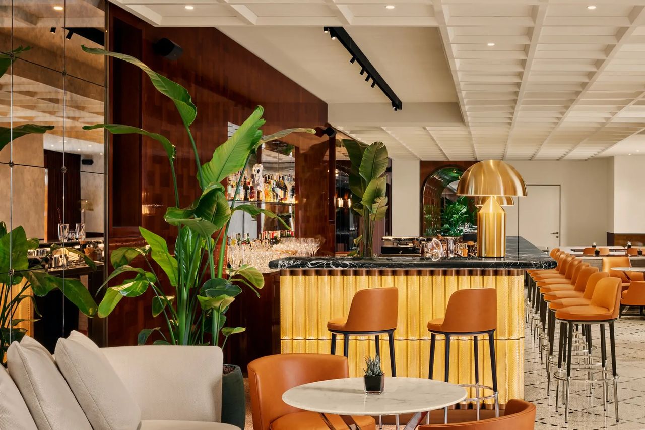 A sleekly furnished hotel lobby.
