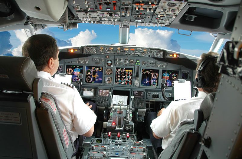 Pilots in airplane cockpit. Politeness is dangerous in high stakes situations, such when a pilot is trying to fly a plane in an emergency.