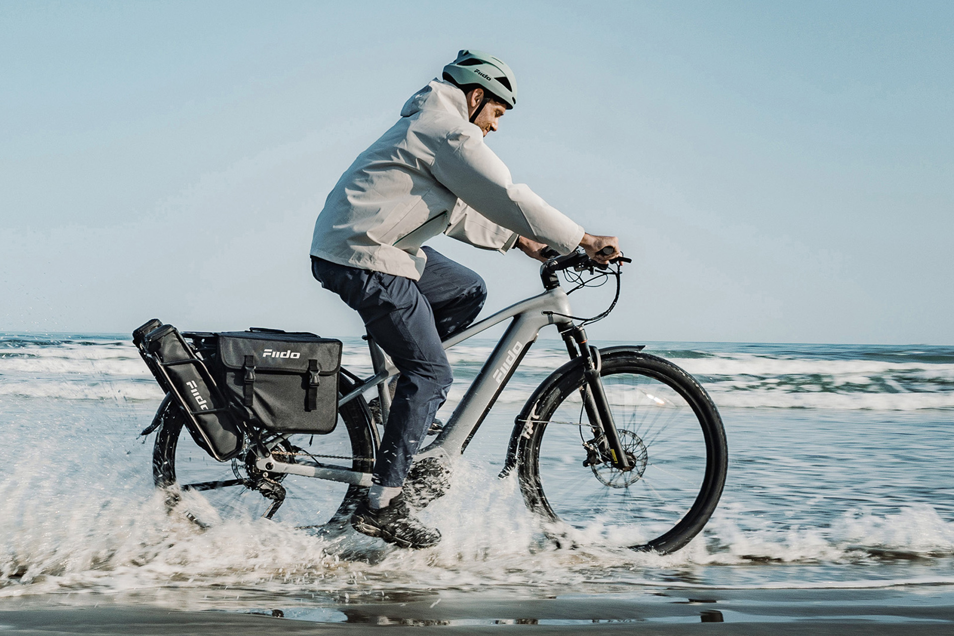 Man riding a Fiido Nomads Pro on the beach
