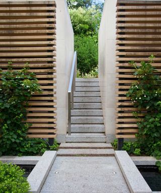 retaining wall with slatted wooden screens and steps