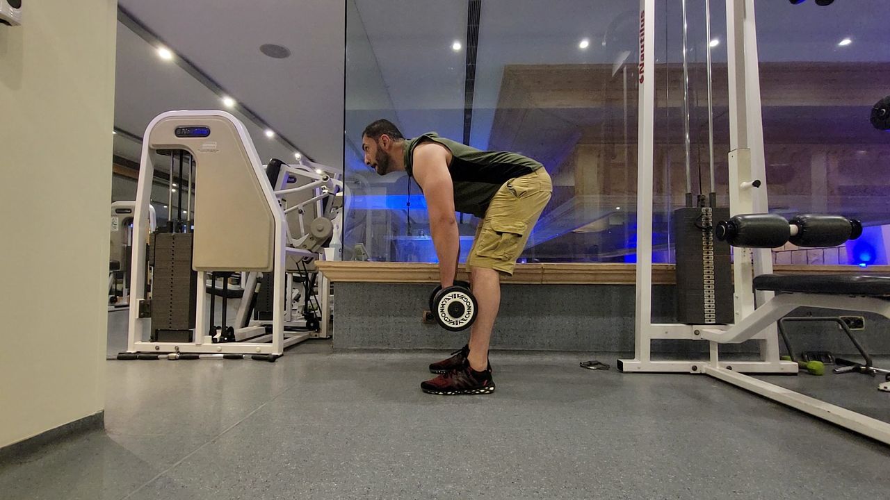 Farzad Aziz starting a dumbbell deadlift